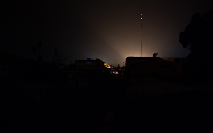 Landscape of a city or town at night that has been hit by an electricity power cut